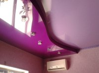 Фиолетовый натяжной потолок в детской